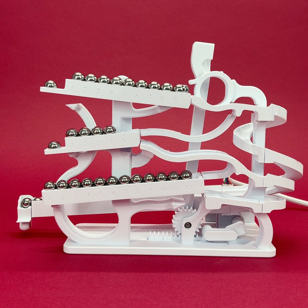 The Tipping Marble Clock – Engineezy